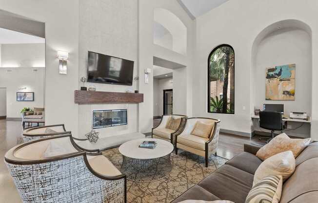 A living room with a fireplace and a television.