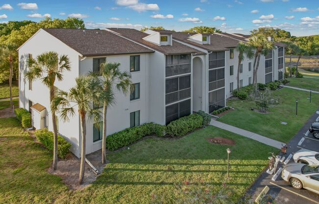 (55+ Furnished) Charming 2-Bedroom, 2-Bath Condo with Lake View in Pine Ridge, Palm Harbor
