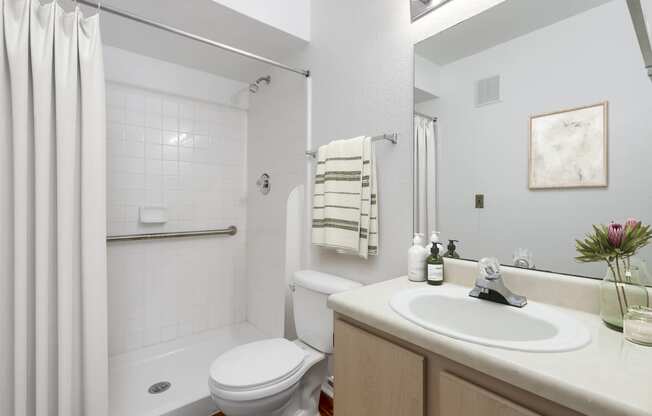 a bathroom with a toilet sink and bathtub