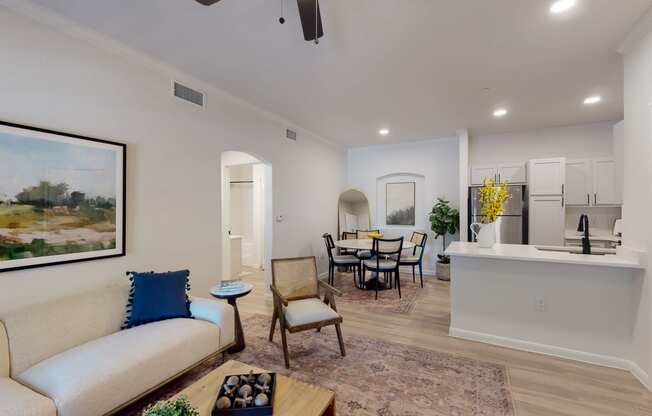 a living room with a couch a coffee table and a chair