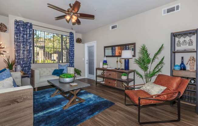 Large Living Room With Ceramic Tile Flooring at The Preserve by Picerne, N Las Vegas, NV