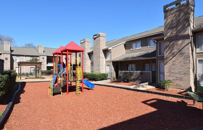 this is a photo of the playground at harvard heights apartments in dallas, tx