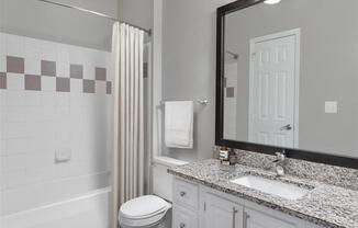 a bathroom with a sink and shower