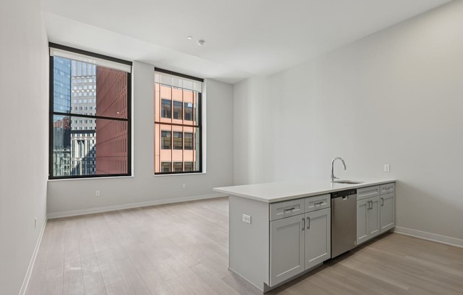 A kitchen with a sink and cabinets.