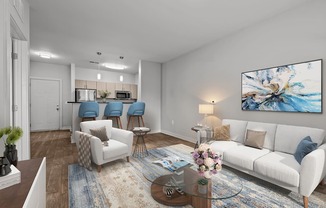 A living room with a white couch, a coffee table, and a painting on the wall.