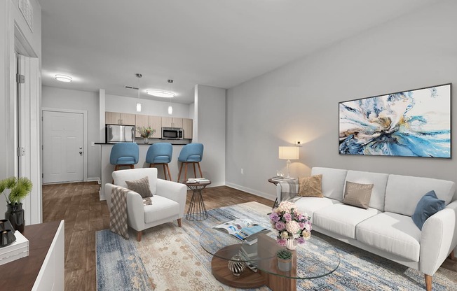 A living room with a white couch, a coffee table, and a painting on the wall.