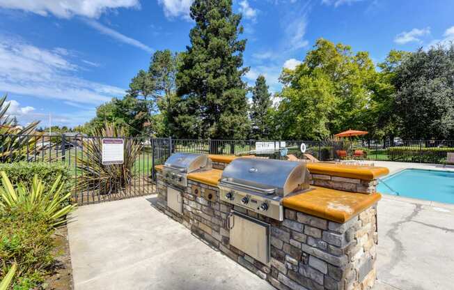 Community gas BBQ's (2) located inside the pool deck area. 