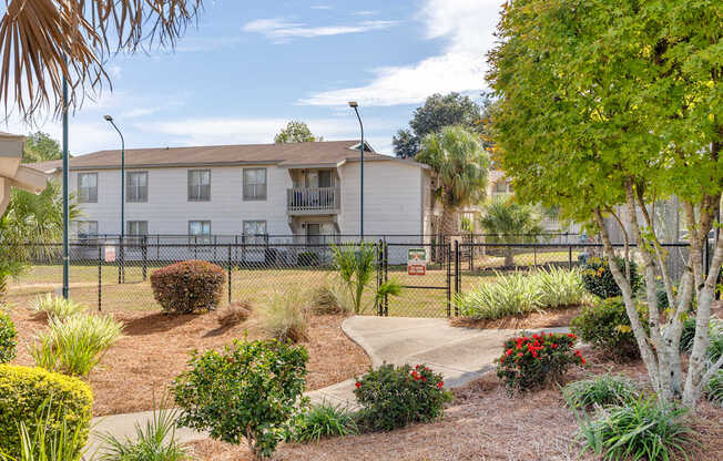 leash-free pet park and building exteriorat 701 South Apartments in Mobile, AL