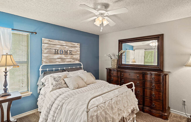 apartment bedroom with a ceiling fan