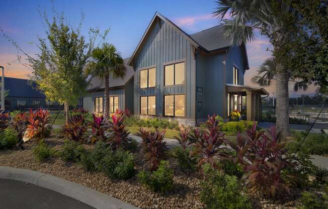 a home with a landscaped garden in front of it at Canter, Ocala
