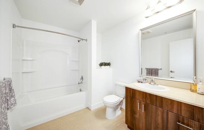 a bathroom with a toilet sink and a bath tub