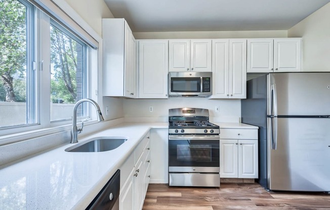 Stainless steel appliances and gas stoves at Windsor at Mariners, 100 Tower Dr., Edgewater