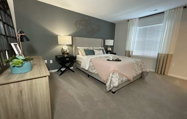 spacious bedroom featuring plush carpet and large windows at Palmetto Place, Fort Mill, 29708