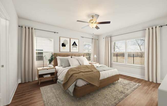 a bedroom with a bed and a ceiling fan