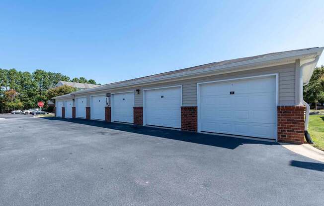 A long row of garage doors are closed.