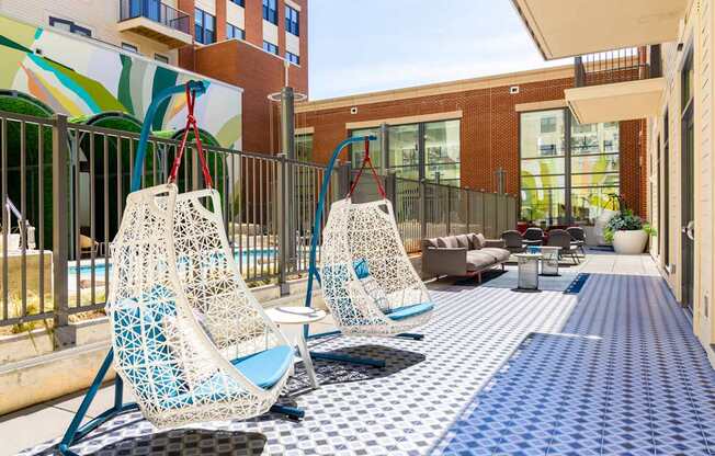 A patio with two chairs and a table.