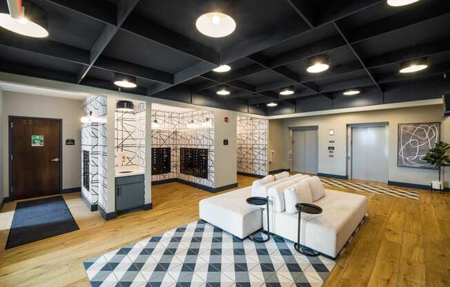 a living room with a white couch and a checkered rug at EagleRidge Plaza Residences, Fargo, North Dakota