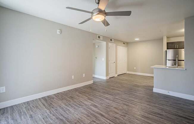 A room with a ceiling fan and wooden flooring at Sterling Point Apartment Homes, Phoenix, 85042