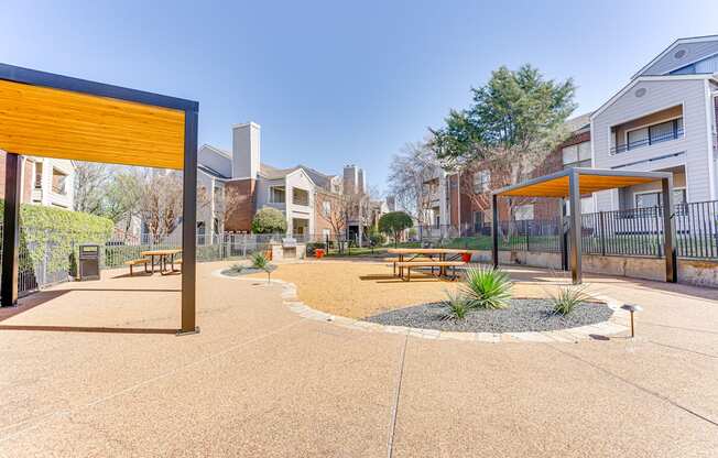 A playground area with a yellow structure and benches.