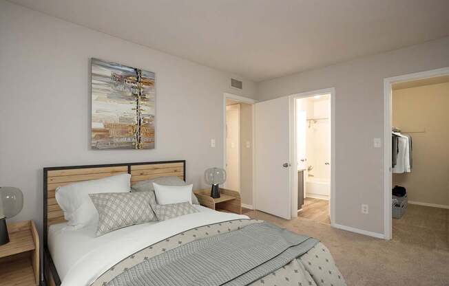 A bedroom with a bed, nightstands, and a painting on the wall.