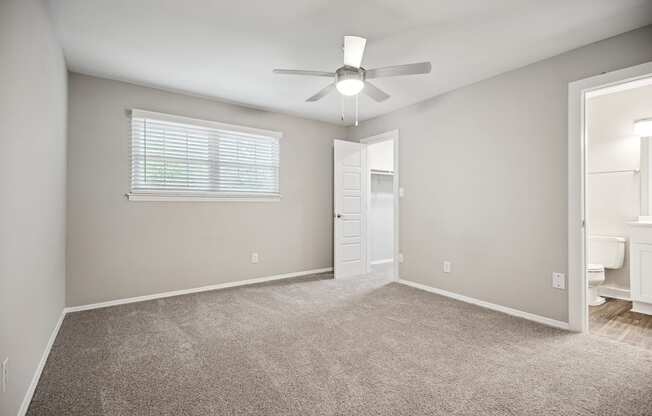 an empty room with carpet and a ceiling fan at Shellbrook, Raleigh, NC