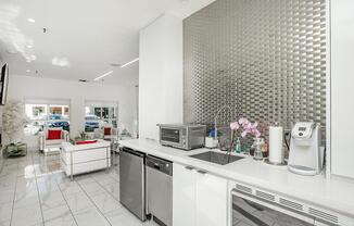 a kitchen with a sink and a microwave