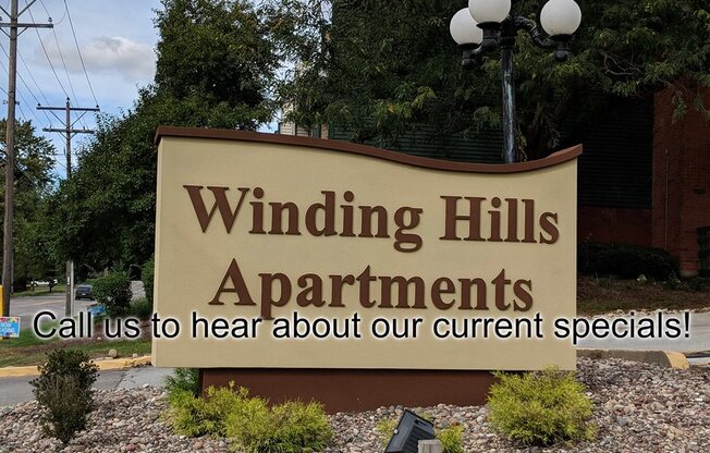 sign reading winding hills apartments