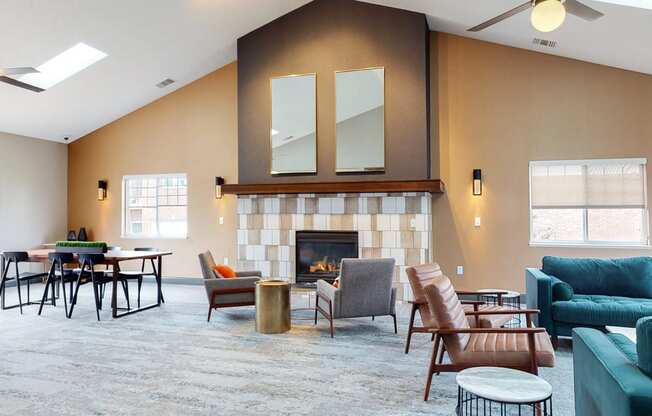 Large clubhouse with vaulted ceiling, fireplace and multiple sitting areas at the Northbrook Apartments