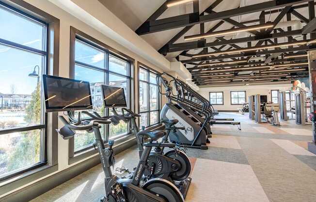 A gym with treadmills and exercise bikes.