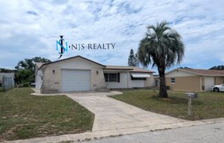 Large open 2/2/1 1378 Sq. Ft. with freshly finished floors, fresh paint, new appliances and located near the heart of Downtown New Port Richey!!