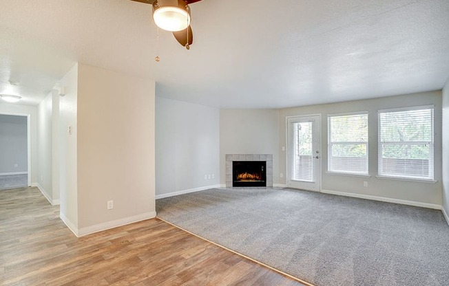 Living room with fireplace near window