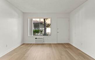 A room with a window and a door.