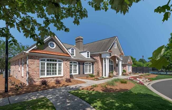 A house with a brick facade and a large front porch.