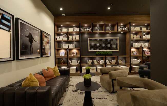 A living room with a brown leather couch and a coffee table.