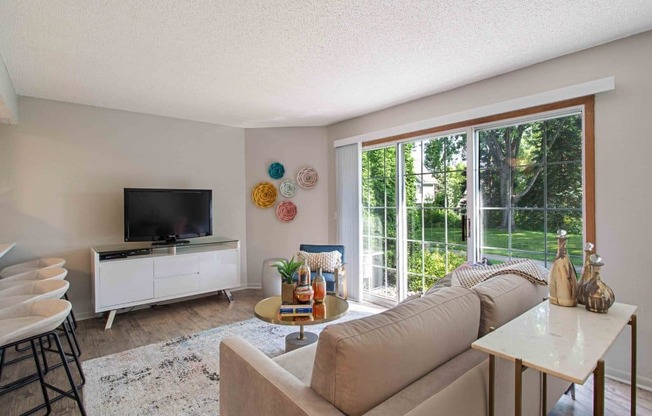 a living room with a couch and a tv