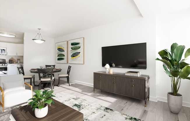 a living room with a large tv and a table and chairs