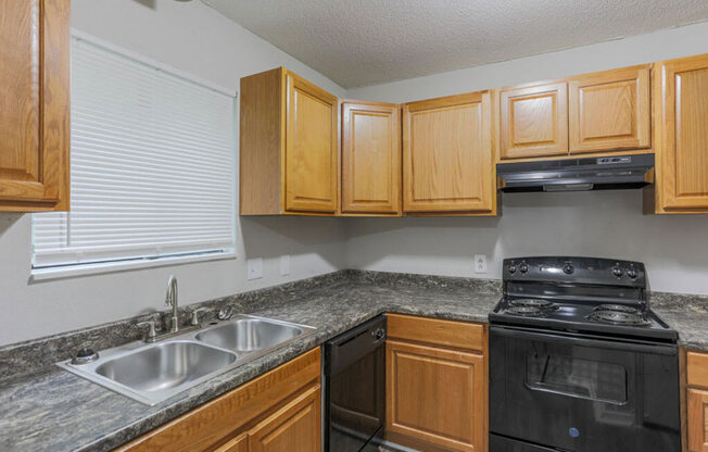 The element 4411, Macon, GA Apartment  kitchen with black appliances