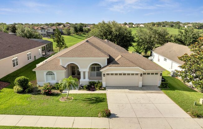 Stunning 4/3 with Fence Enclosed Yard in the Overlook at Lake Louisa in Clermont!