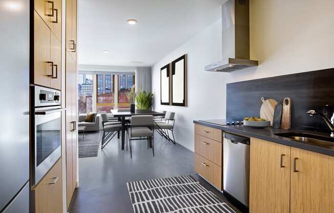 Kitchen and dining area with a table and chairs and a large window