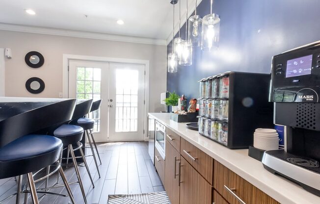 a kitchen with a counter top and a coffee machine