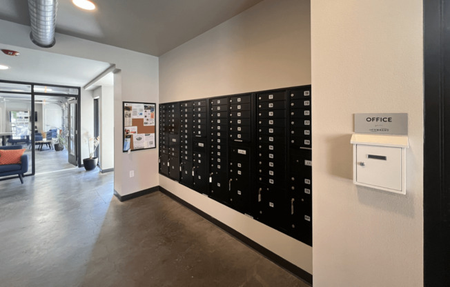 a large filing cabinet on a wall in a hallway of a office