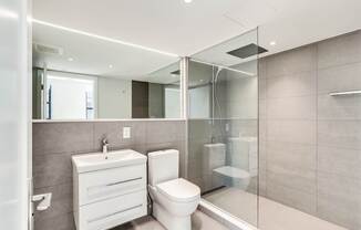 Luxury bathroom with spa inspired shower and extra large mirror