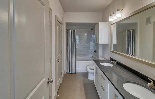 Dual Vanities with Contemporary Lighting at Windsor Oak Hill, 6701 Rialto Blvd, Austin