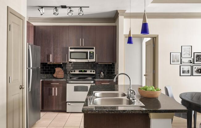 Kitchen featuring a peninsula island and sink