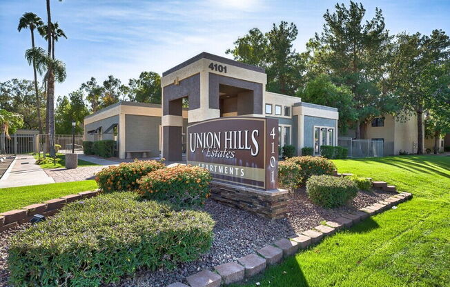 a building with a sign for union hills apartments