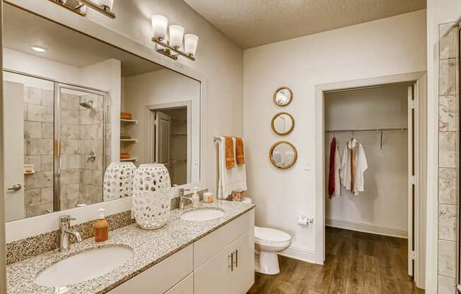 Private bath with double sink vanity and closet at EOS in Orlando, FL