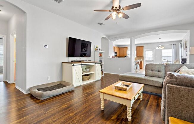 Open Floorpan is Move in Ready just for you! Wood look laminate and Tile run throughout the home with carpet only in the bedrooms.