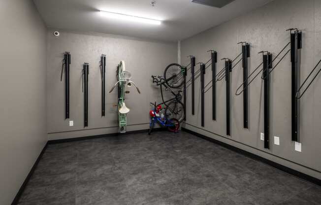 a room with bikes on the wall and a wall mounted bike rack at The Draper, St Louis, Missouri