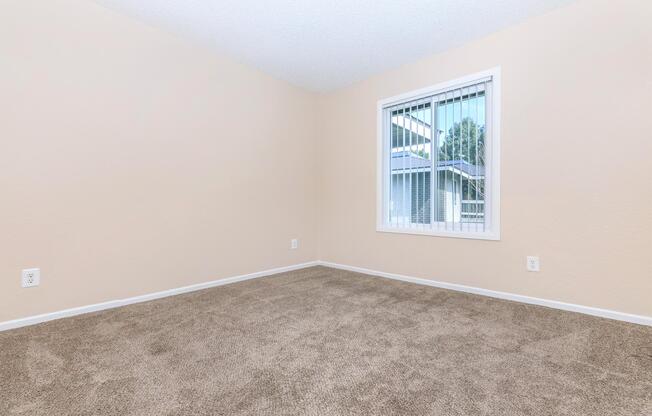 a view of a bedroom next to a window