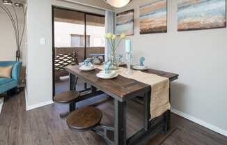 Dining area with sliding glass doors to balcony